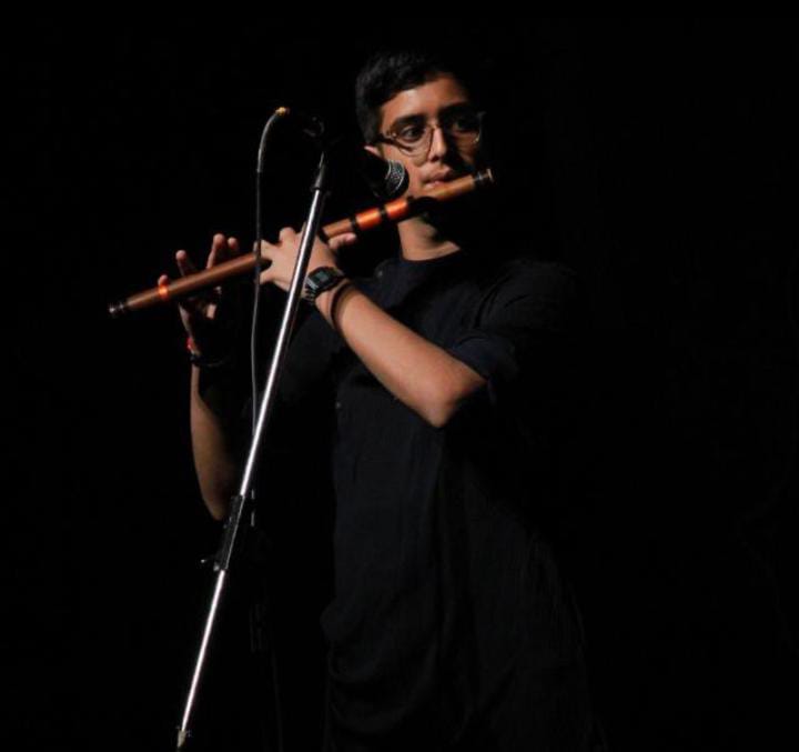 Neel playing flute